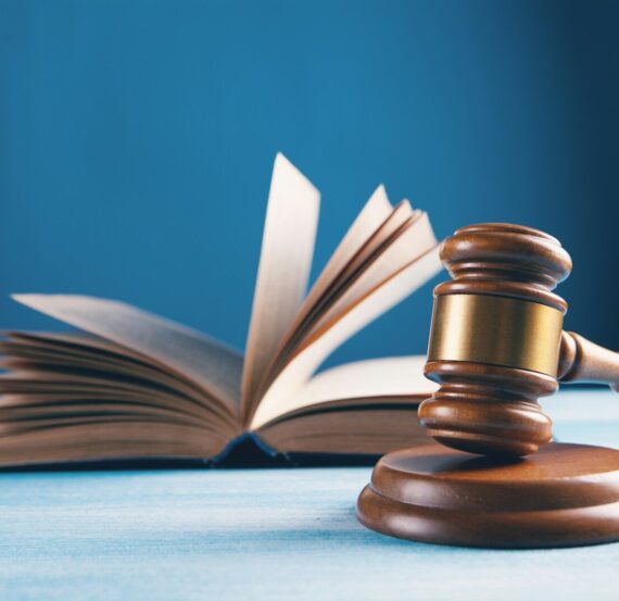 judges gavel and open book on table